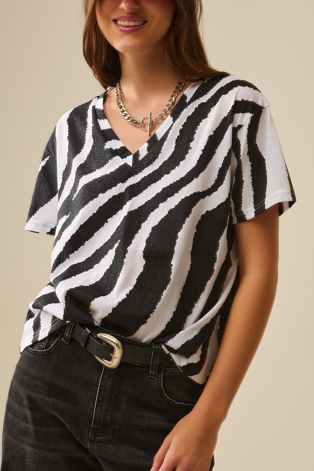 T-shirt met V-hals en zwarte zebraprint